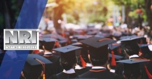 the back of college graduates at a graduation ceremony